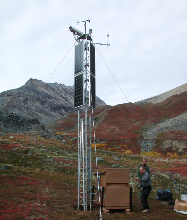 A digital camera and meteorological sensors deployed atop a guyed tower in an Alaskan mountain pass
