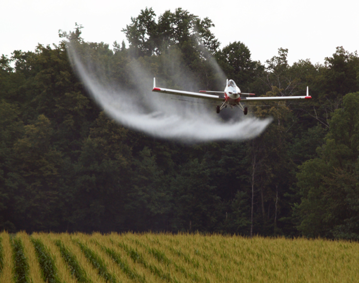 In Alberta, crop dusting is only permitted under certain wind conditions
