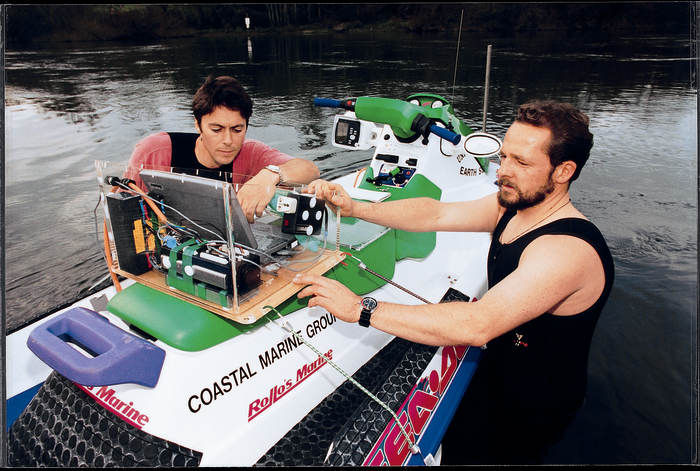 John Radford (left) and Dirk Immenga make final adjustments on the Seadoo-based system before taking a test ride. 